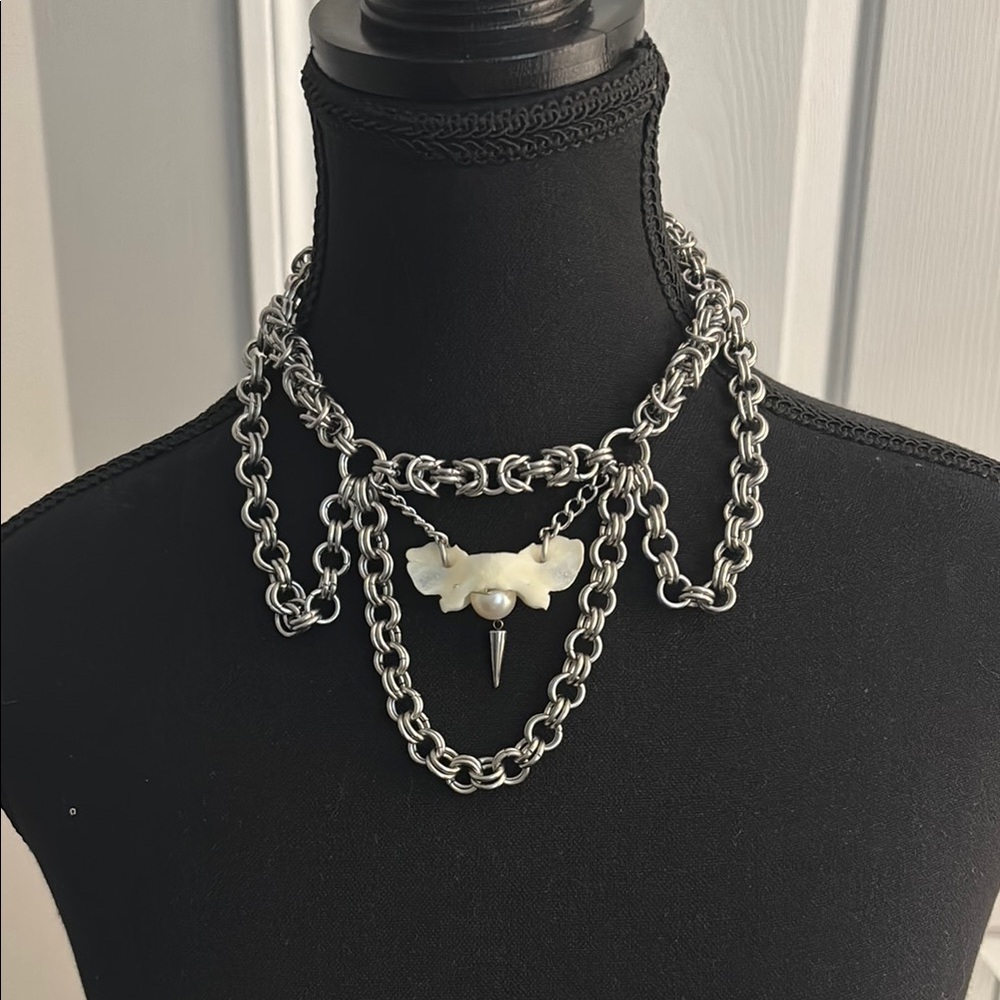 Silver and White Layered Chain Necklace with Decorative Centerpiece
